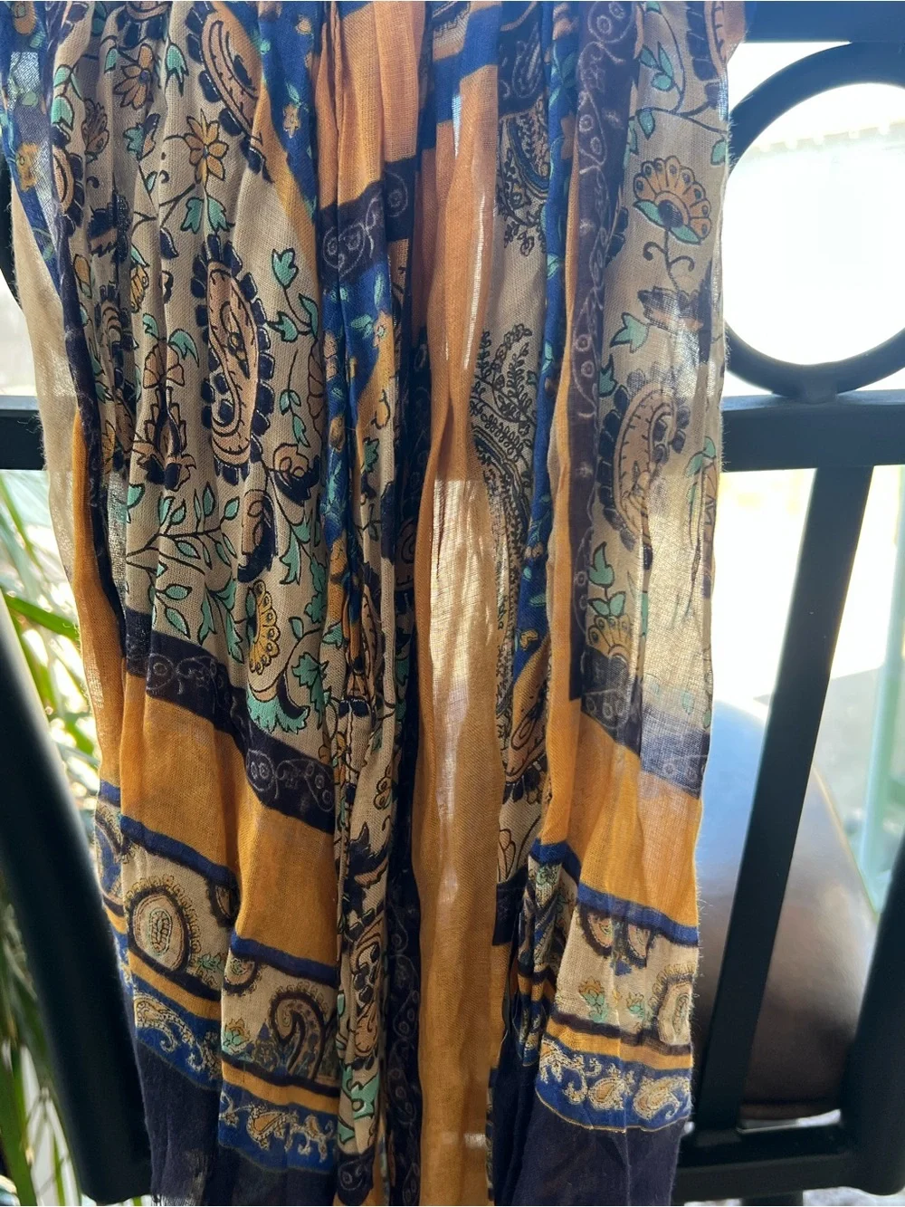 Eight scarves of various colors and styles